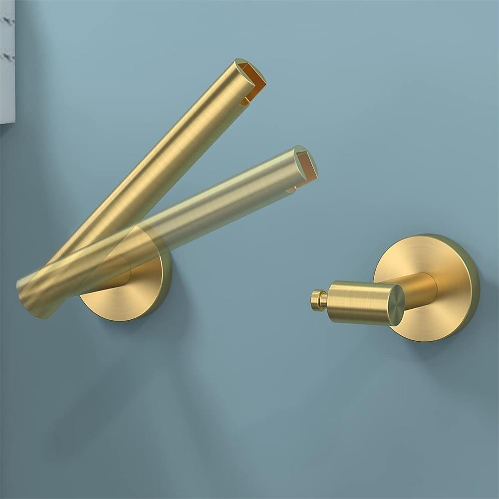 Porte-papier hygiénique mural en acier inoxydable pour toilettes.