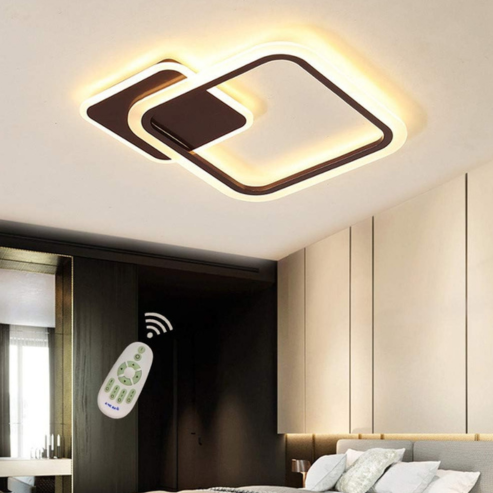 Modern bedroom with a minimalist decor features the Plafonnier LED nordique avec capteur de mouvement PIR, offrant une détection automatique et un éclairage chaleureux idéal pour chambre, salon ou entrée. Remote control in use is also shown.