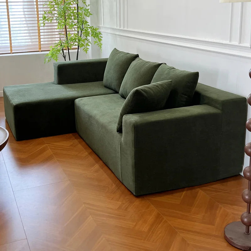 Canapé modulable 4 places vert kaki, 240cm avec coussins assortis.