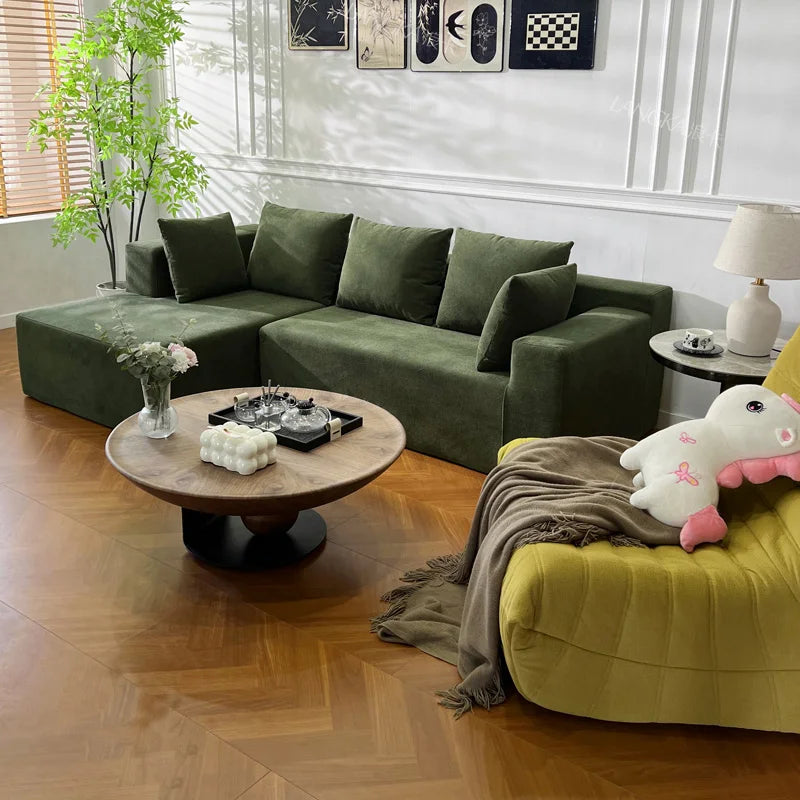 Canapé modulable 4 places vert kaki, 240cm avec coussins assortis.