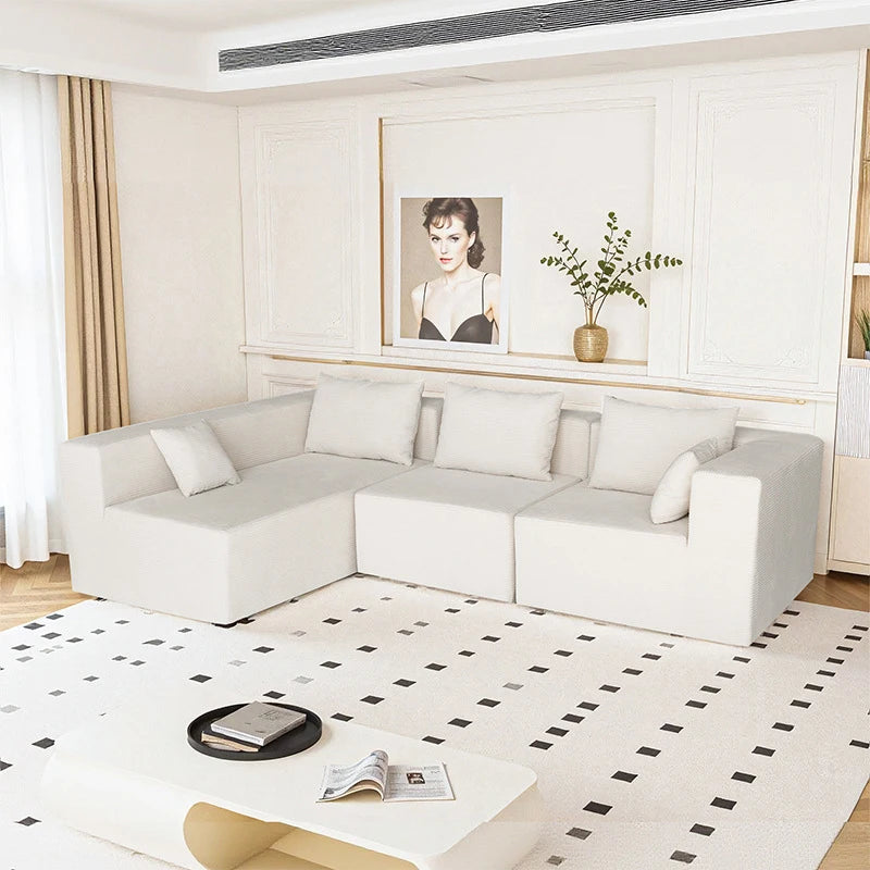 Canapé 4 places modulable blanc, 280cm. Assorti de ses coussins.