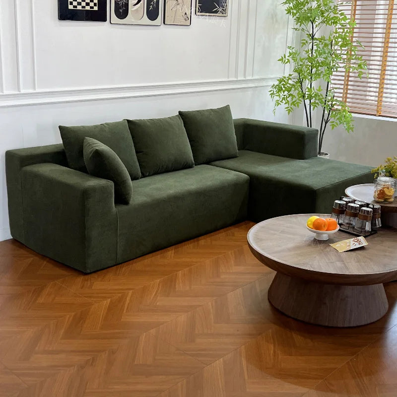 Canapé modulable 4 places vert kaki, 240cm avec coussins assortis.