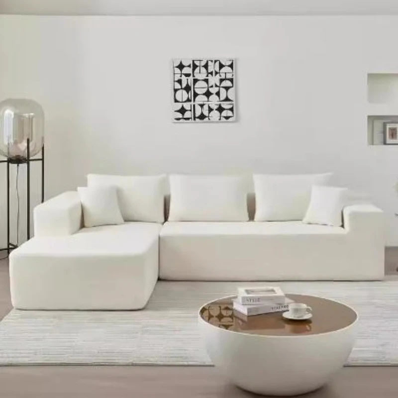 Canapé 4 places modulable blanc, 280cm. Assorti de ses coussins.