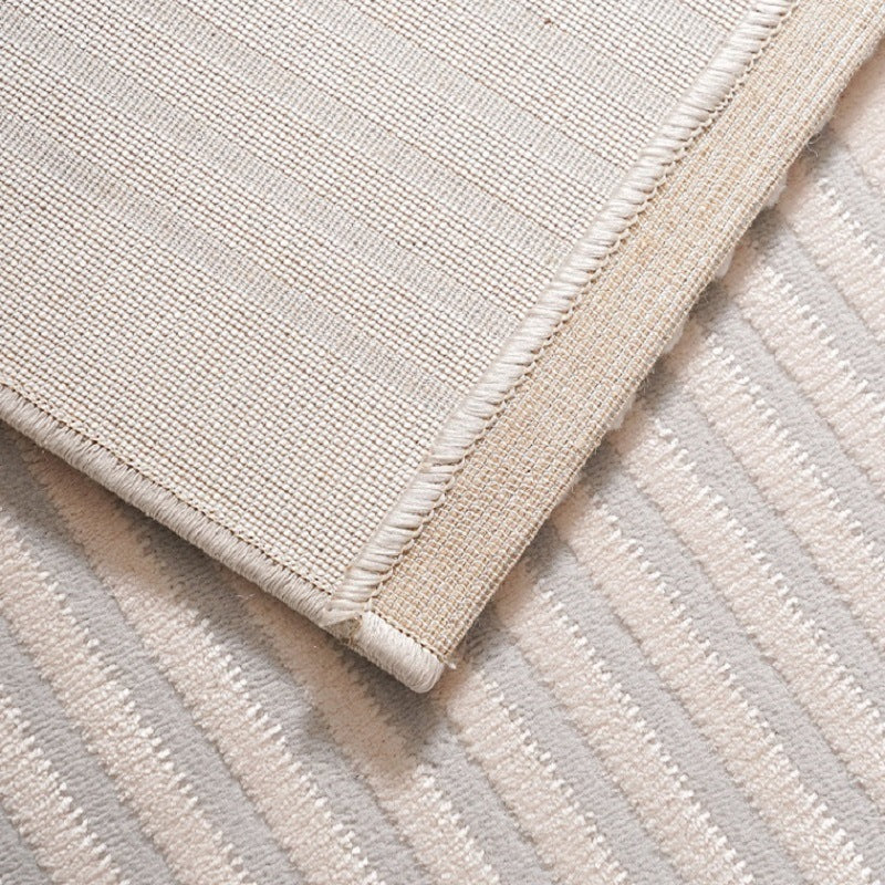 Tapis de sol blanc minimaliste pour salon, matière fibres de polyester luxe léger.