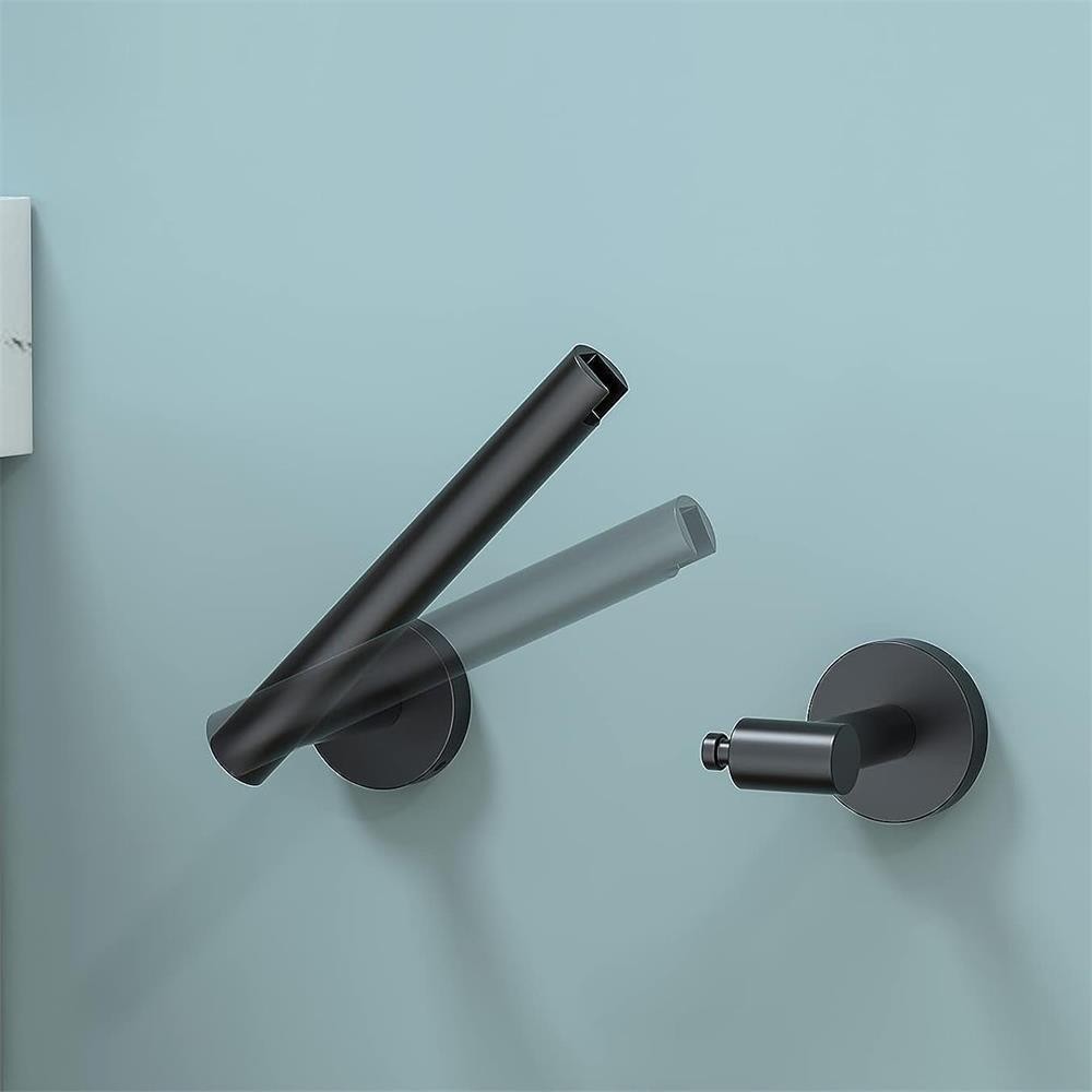 Porte-papier hygiénique mural en acier inoxydable pour toilettes.